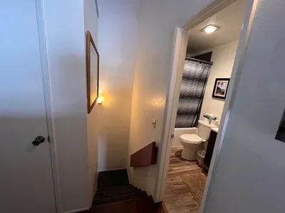 Loft bathroom and stairway to studio below
