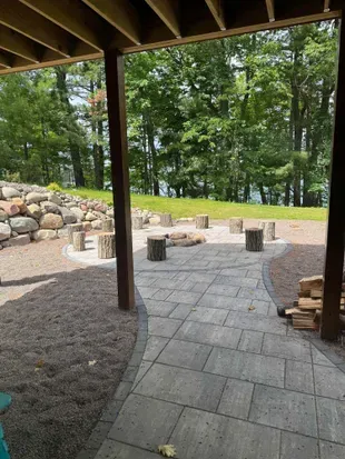 Lakeside #1 finished lower level walk out to fire pit area, private dock, & lake