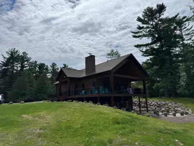 New build w/lake views from all levels! 3k+ sq.ft, 4bdrm / 3bath / twin beds (4) Sleeping Loft, ramp access, covered wrap-around deck, finished lower-level walk out to the fire-pit area and path to private boat dock, and views of sunrise and sunset.