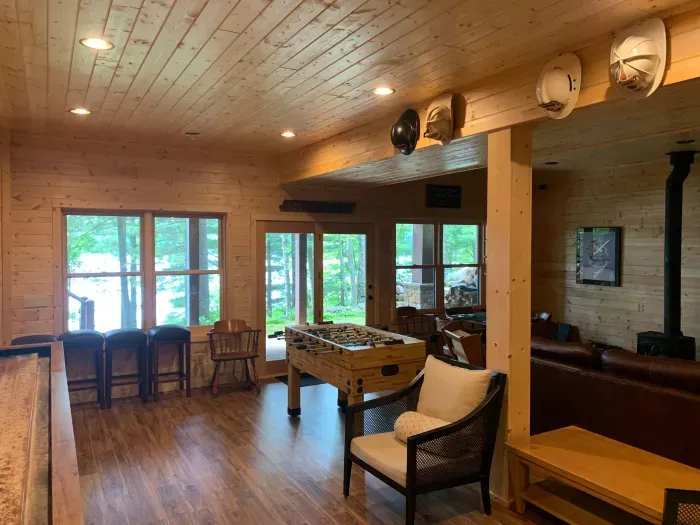 Finished walk-out lower level.  2 bedrooms with queen beds + 1 full shared bathroom on this level.  (Accurate Illustration, AI Enhanced Decor Due to Build In Progress)  