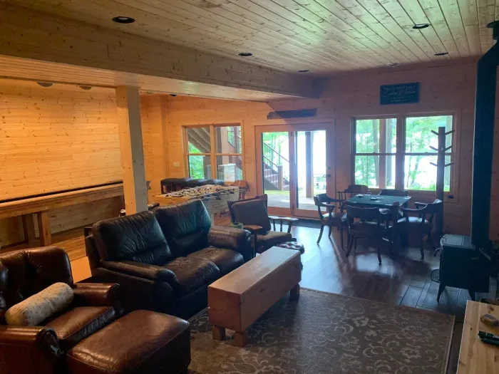 Finished walk-out lower level.  2 bedrooms with queen beds + 1 full shared bathroom on this level.  (Accurate Illustration, AI Enhanced Decor Due to Build In Progress) 