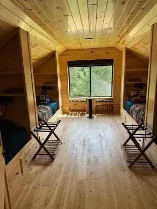 For those additional Guests and kids, the 2nd floor closed sleeping loft is a perfect space!!  Each of the 4 built-in twin beds has its own reading light, drawers for clothes storage, and a luggage rack for a suitcase or bag.