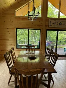 Main level dining table for 6 persons, intended to be used in combination with the 6-person seating kitchen island for larger group dining.  Additional dining table also found in the lower level for 4-persons.