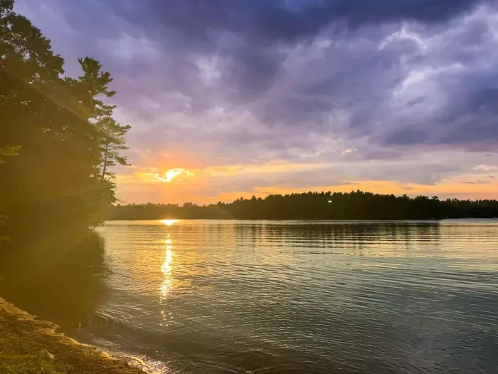 Sunset view from lakeshore location of private boat dock to be installed for Lakeside #1 in May 2026.  
