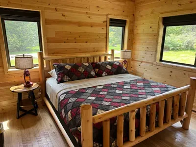 King size bed in the master bedroom suite with accompanying dual vanity bathroom and walk-in shower.