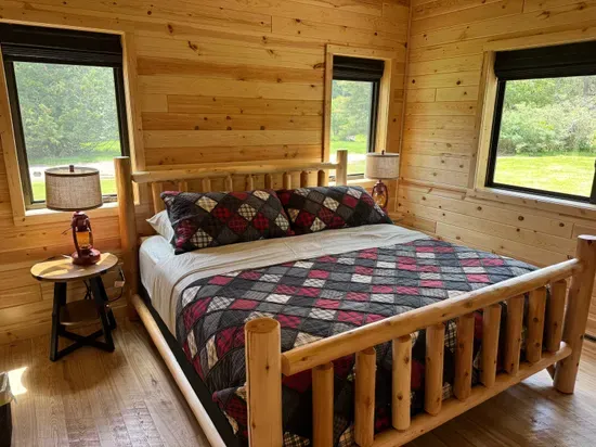 King size bed in the master bedroom suite with accompanying dual vanity bathroom and walk-in shower.