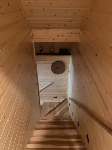 Finished walk-out lower level.  2 bedrooms with queen beds + 1 full shared bathroom on this level.  (Accurate Illustration, AI Enhanced Decor Due to Build In Progress)