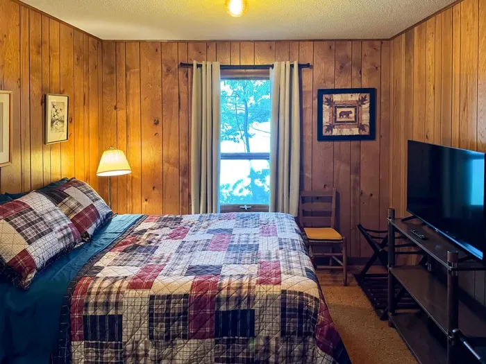 Bedroom #3 with Full Size Double Bed, Internet Connected Smart TV, Clothes Hanging Closet, Duo Suit Case Stands, Dresser w/Multi-Function Light Settings & Smart Device Outlets, Duo Night Stands w/Smart Device Outlets, & Black-Out Window Shades