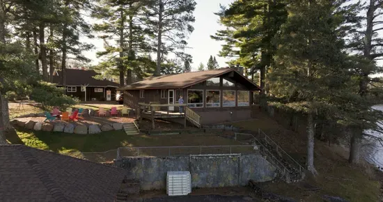 5RK Ranch Lakeside Lodge, Boathouse, Boat Dock (Up to 4 Boats), and 1000+ Ft of Private Sandy Beach and Swim Area..  The boat docs form a protective shallow swim area great for young kids.
