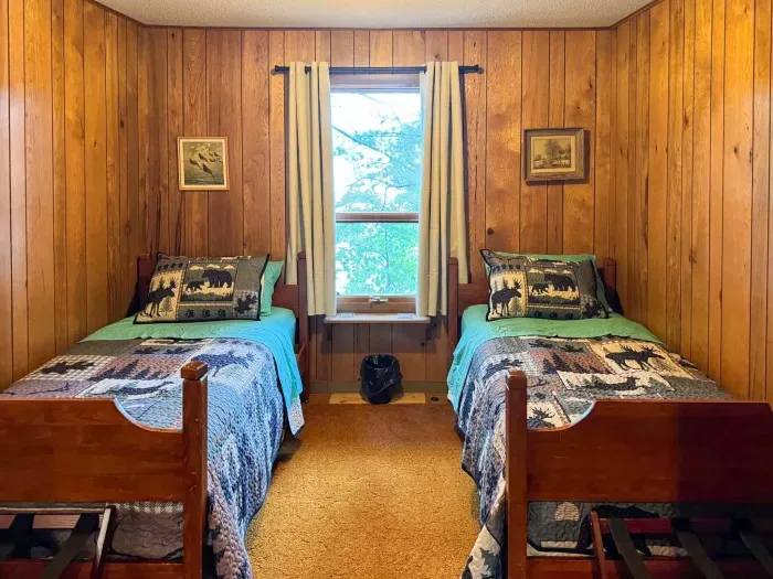 Bedroom #4 with 2 (two) twin Beds, Clothes Hanging Closet, Suit Case Stands for 2 Guests, Dresser w/Multi-Function Light / Day Time, Night-Light Settings & Smart Device Outlets, Shared Bed-Side Shelf Between Beds, & Black-Out Window Shades