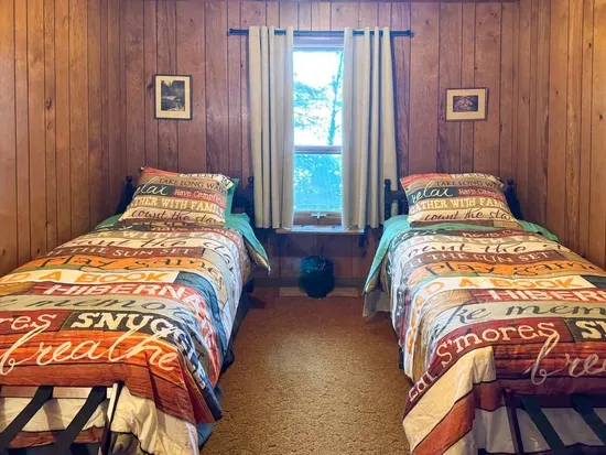 Bedroom #5 with 2 (two) twin Beds, Clothes Hanging Closet, Suit Case Stands for 2 Guests, Dresser w/Multi-Function Light / Day Time, Night-Light Settings & Smart Device Outlets, Shared Bed-Side Shelf Between Beds, & Black-Out Window Shades