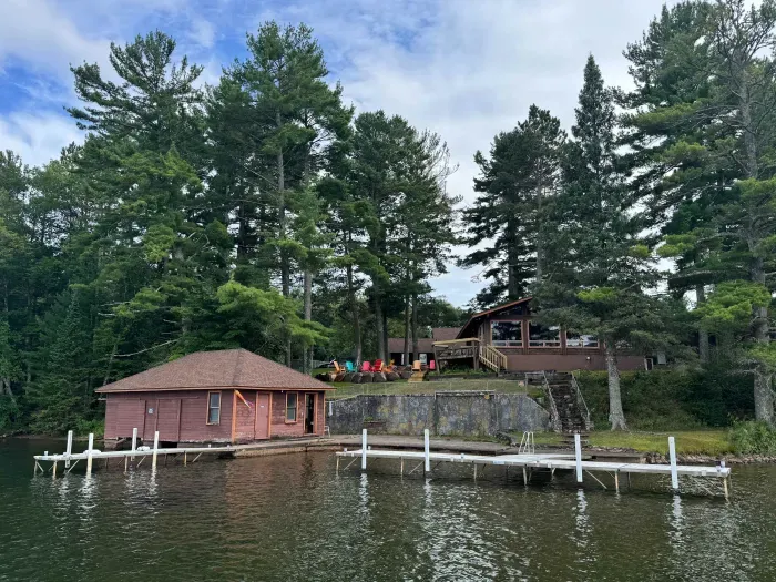 5RK Ranch Lakeside Lodge, Boathouse, Boat Dock (Up to 4 Boats), and 1000+ Ft of Private Sandy Beach and Swim Area..  The boat docs form a protective shallow swim area great for young kids.  