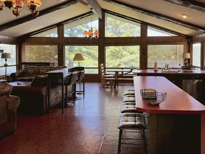 View of great room, kitchen, dining, and living room area from the front entrance door of the 5RK Lodge ... lake view is expansive and is less than 50 ft from the overlook windows.