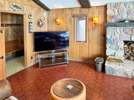 65" smart TV as seen from the loveseat within the Lodge great room