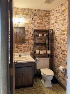 Located just inside the front entrance and accessible within the entry hallway of the 5RK Ranch Lodge guests will find this well appointed half-bathroom inclusive of hand towels, spa quality liquid hand soap, and well stocked with necessities