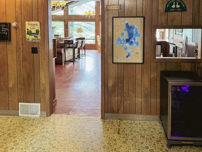 Front entry door hallway looking thru doorway to great room, kitchen, dining, and living room area .... a great place to drop off dirty shoes, boots, or snowy things in the winter season!!
