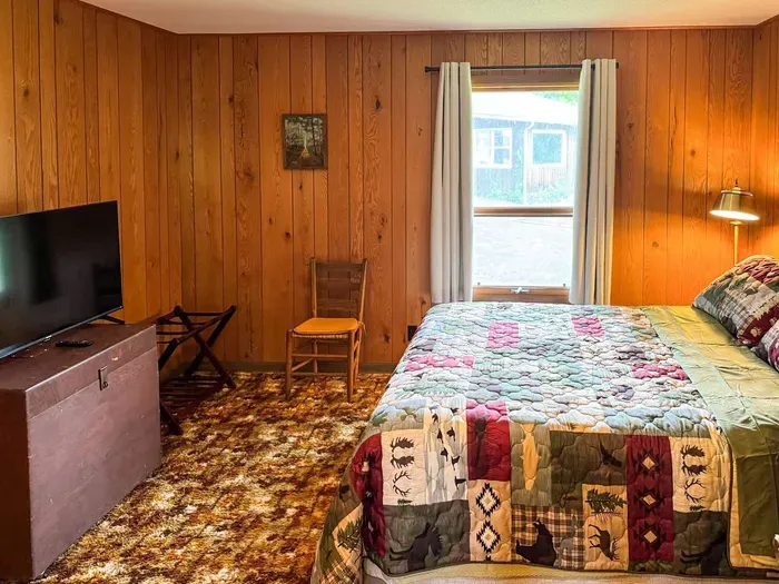 Bedroom #2 with Queen-Size Bed, Internet Connected Smart TV, Clothes Hanging Closet, Duo Suit Case Stands, Dresser w/Multi-Function Light Settings & Smart Device Outlets, Duo Night Stands w/Smart Device Outlets, & Black-Out Window Shades