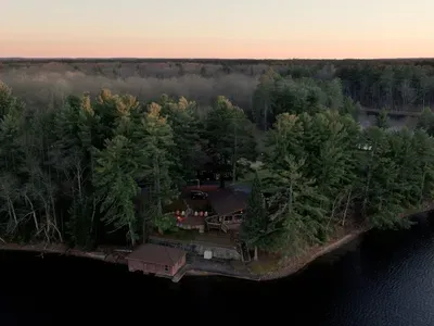 5RK Ranch Lakeside Lodge, Boathouse, Boat Dock (Up to 4 Boats), and 1000+ Ft of Private Sandy Beach and Swim Area..  The boat docs form a protective shallow swim area great for young kids.