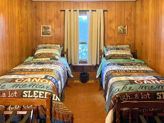 Bedroom #6 with 2 (two) twin Beds, Clothes Hanging Closet, Suit Case Stands for 2 Guests, Dresser w/Multi-Function Light / Day Time, Night-Light Settings & Smart Device Outlets, Shared Bed-Side Shelf Between Beds, & Black-Out Window Shades