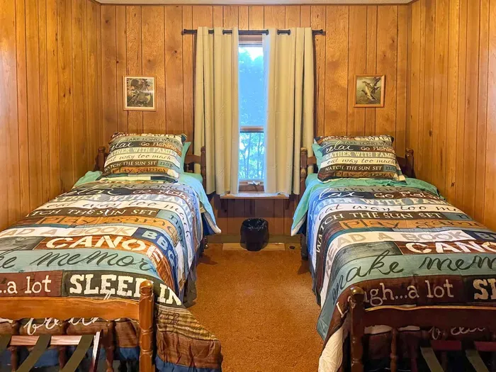 Bedroom #6 with 2 (two) twin Beds, Clothes Hanging Closet, Suit Case Stands for 2 Guests, Dresser w/Multi-Function Light / Day Time, Night-Light Settings & Smart Device Outlets, Shared Bed-Side Shelf Between Beds, & Black-Out Window Shades