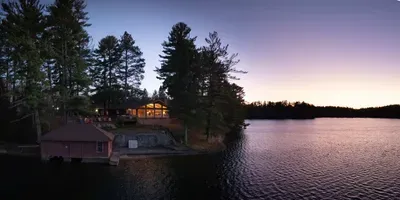 5RK Ranch Lakeside Lodge, Boathouse, Boat Dock (Up to 4 Boats), and 1000+ Ft of Private Sandy Beach and Swim Area..  The boat docs form a protective shallow swim area great for young kids.