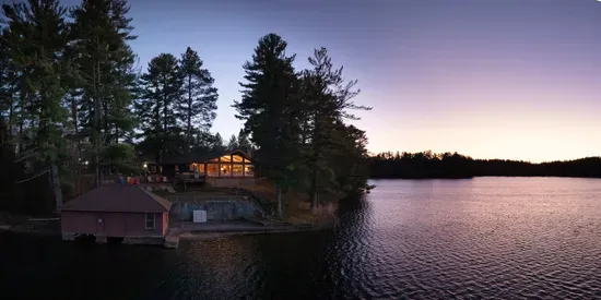 5RK Ranch Lakeside Lodge, Boathouse, Boat Dock (Up to 4 Boats), and 1000+ Ft of Private Sandy Beach and Swim Area..  The boat docs form a protective shallow swim area great for young kids.