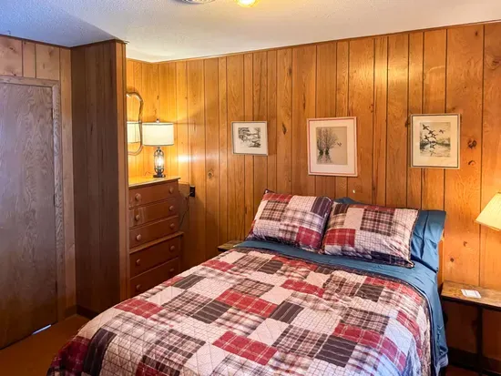 Bedroom #3 with Full Size Double Bed, Internet Connected Smart TV, Clothes Hanging Closet, Duo Suit Case Stands, Dresser w/Multi-Function Light Settings & Smart Device Outlets, Duo Night Stands w/Smart Device Outlets, & Black-Out Window Shades