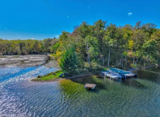 Aerial view of the Peninsula Lakehouse on 5RK Ranch Lakeside with expansive panoramic view of the end of the property and waterway access to Osprey Lake (by Kayak or Canoe only).
