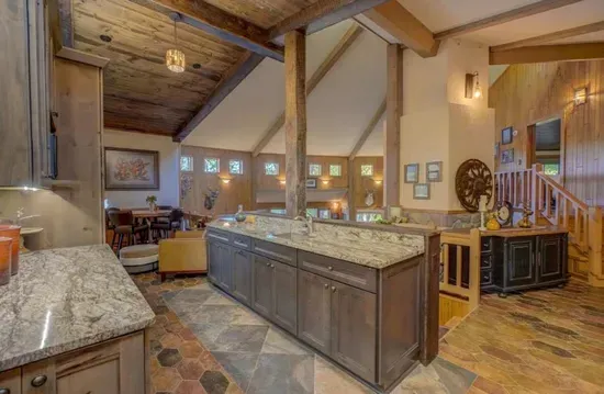 Updated and refreshed upscale kitchen and dining area with open views to the large great room / hearth room living area.