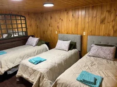 Peninsula Lake House is comprised of a finished lower level utility space that serves multiple purposes; full size washer dryer / sink, 2nd refrigerator/freezer, and split-room bunk room for kids and youth with 4 twin beds.