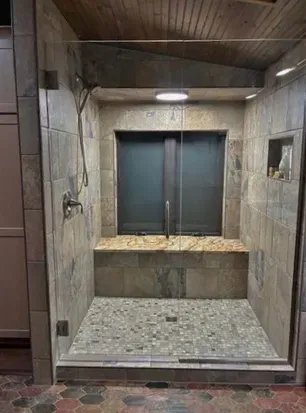 Newly renovated master bedroom lake view suite with dual vanity bathroom ensuite including custom oversized shower