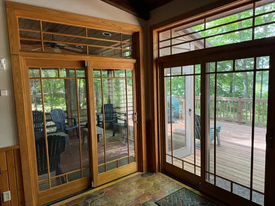 Access to large screened in porch and expansive wrap around viewing deck off the kitchen and lounge area.