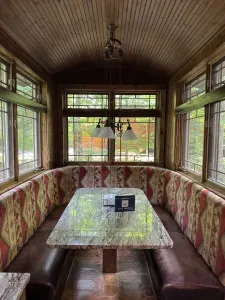 View of in-kitchen dining area within the Peninsula Lakehouse.  This is a bi-level open floor plan with continuous views of the lake and follows the contour of the lots' peninsula shoreline.
