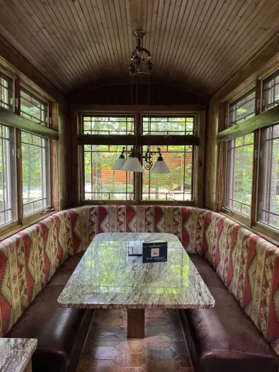 View of in-kitchen dining area within the Peninsula Lakehouse.  This is a bi-level open floor plan with continuous views of the lake and follows the contour of the lots' peninsula shoreline.