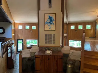 View of front entry foyer of the Peninsula Lakehouse.  This is a bi-level open floor plan with continuous views of the lake and follows the contour of the lots' peninsula shoreline.  Gourmet eat-in kitchen, large great room, dining area, 65" smart TV