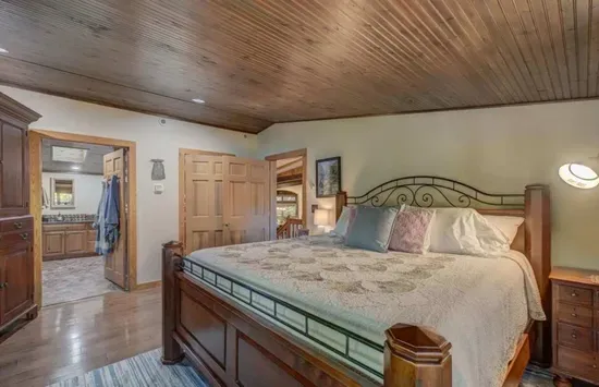 Newly renovated queen bed master bedroom lake view suite with dual vanity bathroom ensuite including custom oversized shower