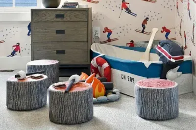 Bunk beds, ski wallpaper, and a toy boat — this room does not do boring.