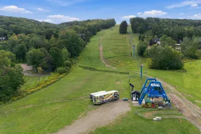 Holimont bike park at Sunset lift. Ride Sunset lift to Spruce Lake for kayaking and SUPs.
