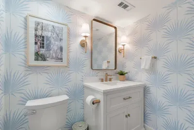 Hall bathroom with glass shower and oversized vanity