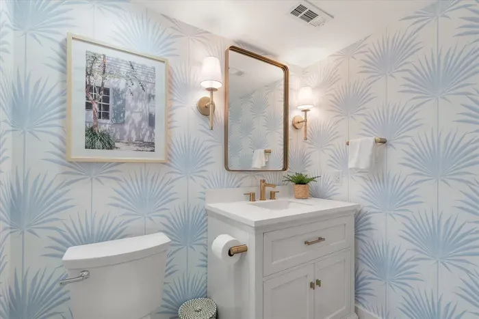 Hall bathroom with glass shower and oversized vanity