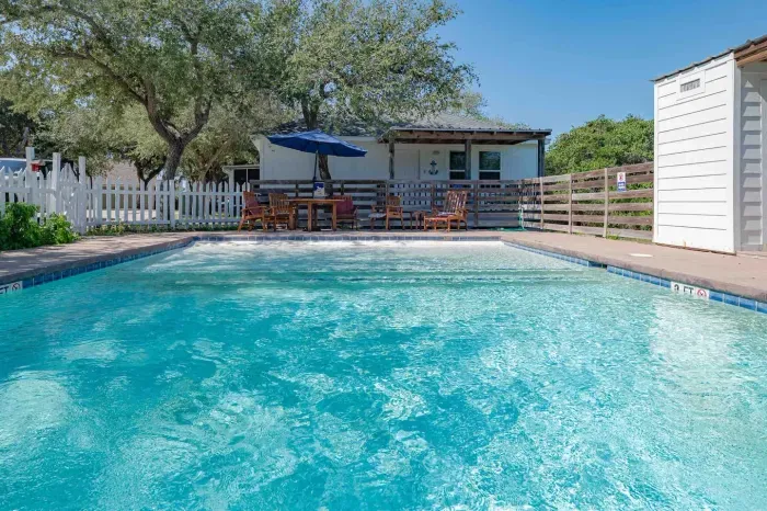 Conveniently, there is a washroom located within the pool area.