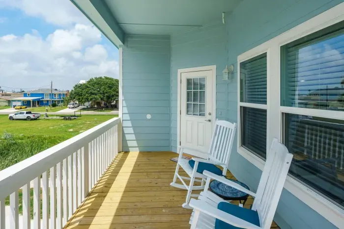 Enjoy the coastal breeze on these rocking chairs on the upstairs deck. 