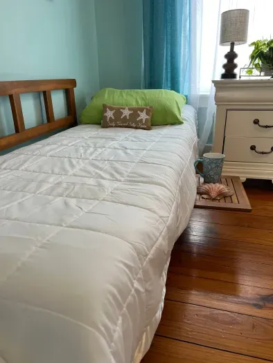 Mini-sofa arms lay flat to convert to sing bed. Suitable for a kiddo or small adult under 5'6