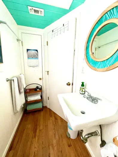 Full bathroom in main house which includes stall shower and hand wand shower head.  Towels, hygiene products provided