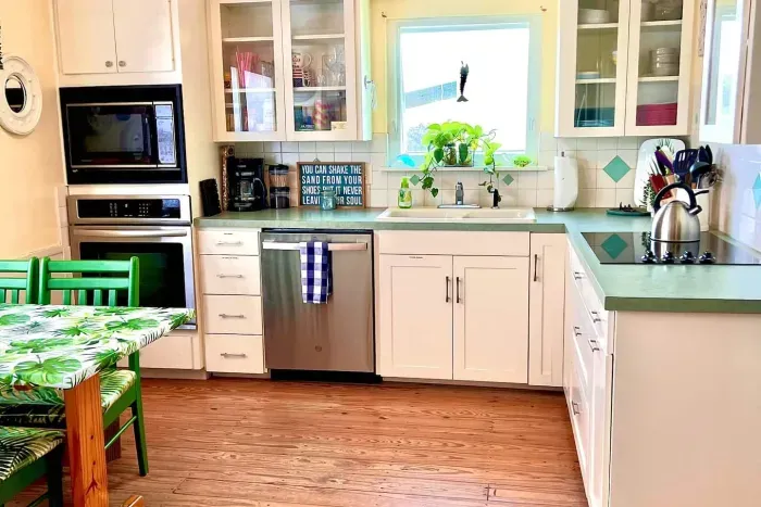 Stainless steel appliances and one very cool OLD microwave which works great.