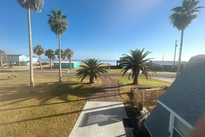Bay view from elevated deck, just outside main bedroom, featuring King-size bed