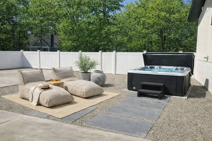Private hot tub retreat with cozy lounge seating—perfect for relaxing after a day at the beach or exploring New Buffalo.