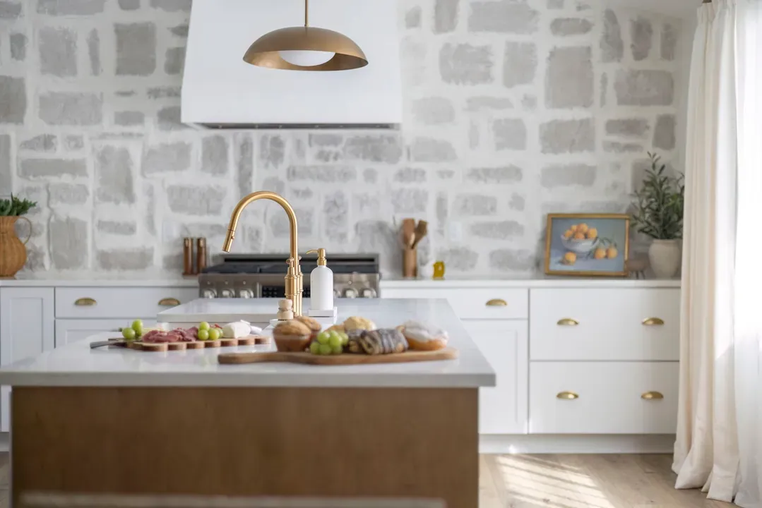 europeaninspiredkitchenwithislandandbrasslights