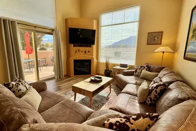 Spacious living area with large leather sectional and huge views!