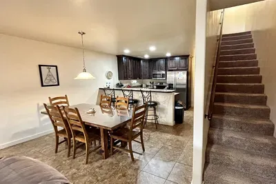 Stairs lead to the upstairs bedrooms